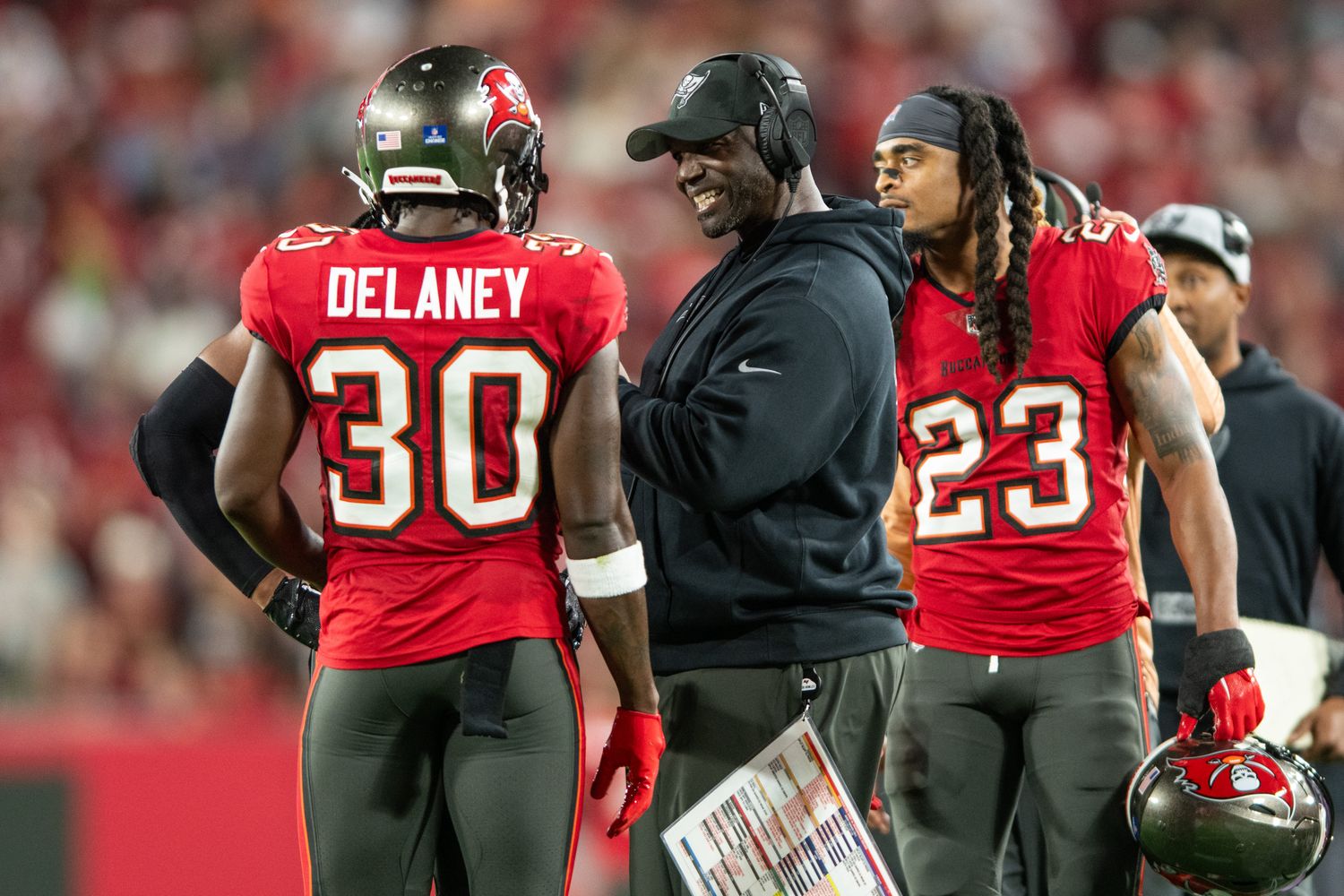 Tampa Bay Buccaneers head coach Todd Bowles talks with defensive back Dee Delaney (30) against the Jacksonville Jaguars in the fourth quarter at Raymond James Stadium. Mandatory Credit: Jeremy Reper-USA TODAY Sports